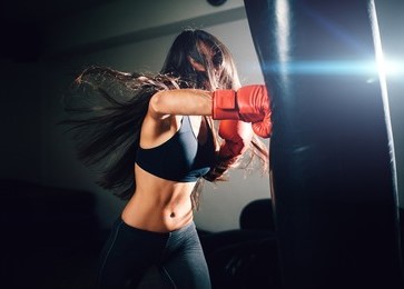 girl-hitting-punching bag